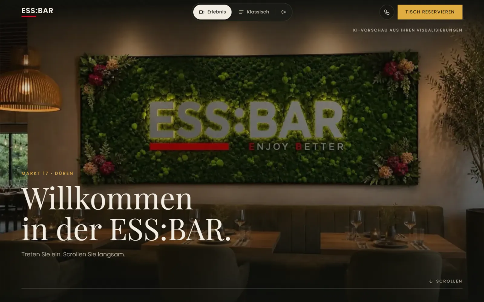 Startseite der ESS:BAR mit der Mooswand und dem Schriftzug Willkommen in der ESS:BAR